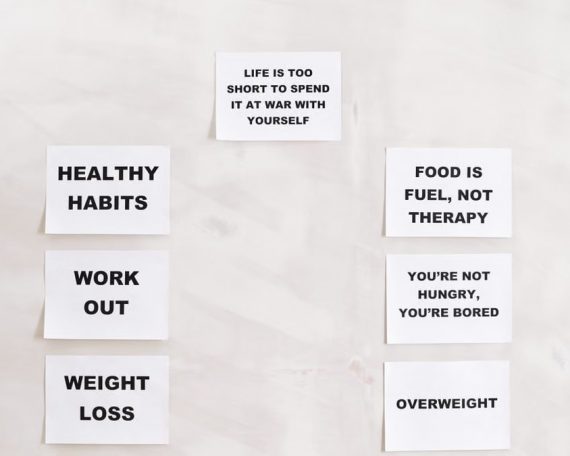 Minimalist display of motivational health and wellness quotes emphasizing healthy habits and weight management.